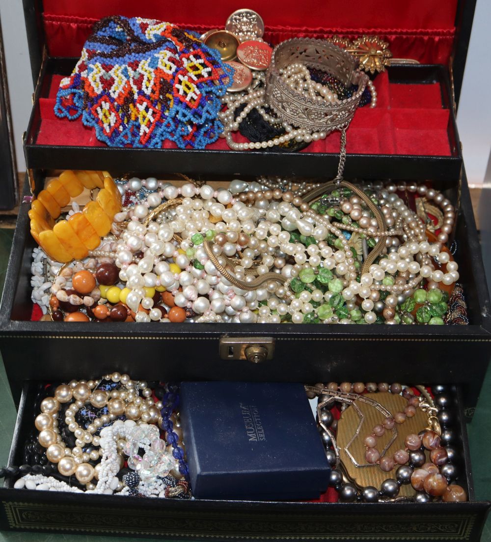 An amber bracelet and a quantity of mixed costume jewellery.